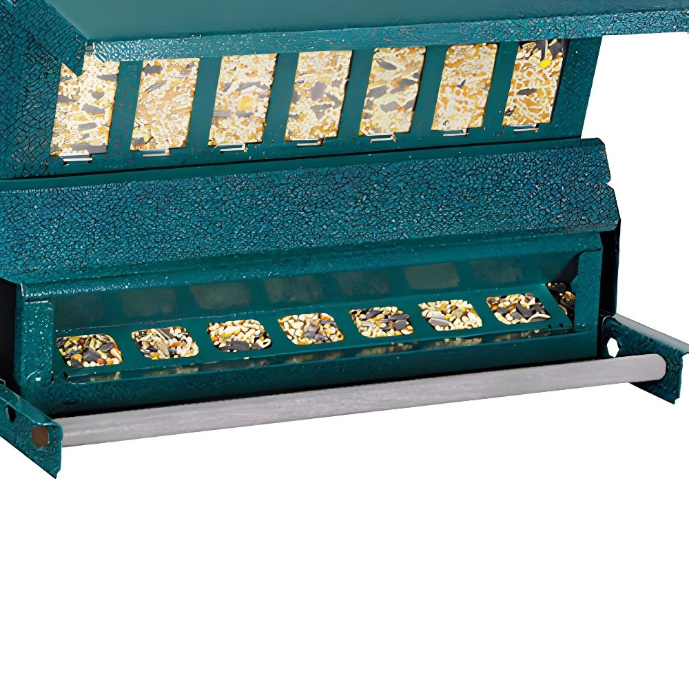 A close-up of a teal green bird feeder with multiple seed hopper compartments and a silver metal bar, shown against a plain white background

perch & weather